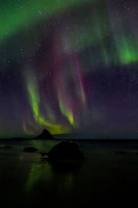 Scenic view of sea against sky at night