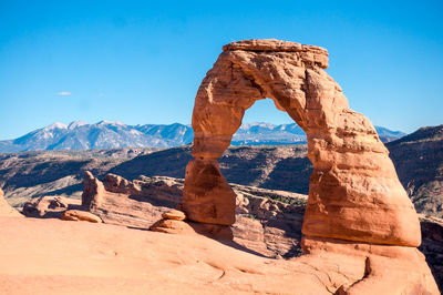 Rock formation against clear blue sky