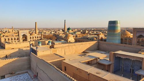 Charming old sand city with blue minaret