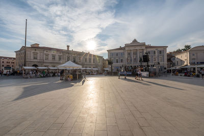 People walking on street in city