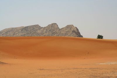 Scenic view of desert against clear sky