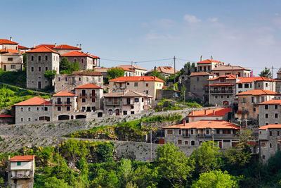 Buildings in city against sky