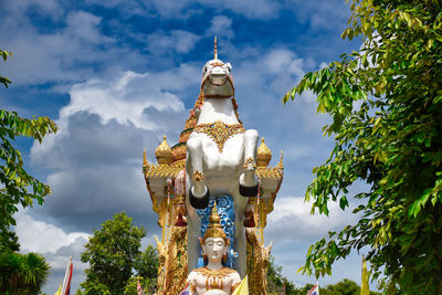 Statue of deity, god or goddess riding a horse at the wat chai chumphon chana songkhram temple