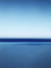 Close-up of sea against clear blue sky