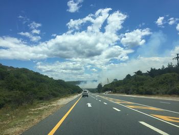 Road amidst landscape against sky