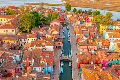 Positive colorful rainbow island of burano. city on water venice. drone type. places worth visiting