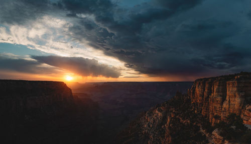 Scenic view of grand canyon against cloudy sky during sunset