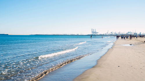 Scenic view of beach against clear sky