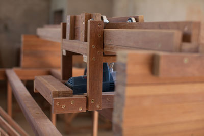 Close-up of wooden bench on table