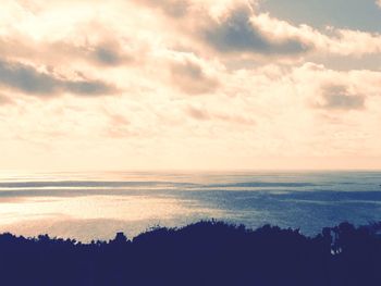 Scenic view of sea against sky at sunset