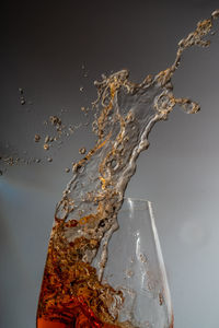 Close-up of water splashing on glass