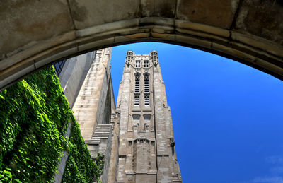 Low angle view of historical building against blue sky