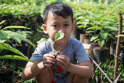 Portrait of boy eating fruit