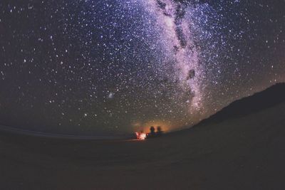 Firework display in sky at night