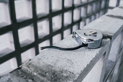 Close up view of measuring tape on concrete block