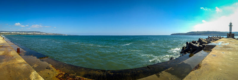 Panoramic view of sea against blue sky