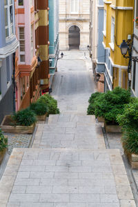 Empty alley amidst buildings in city