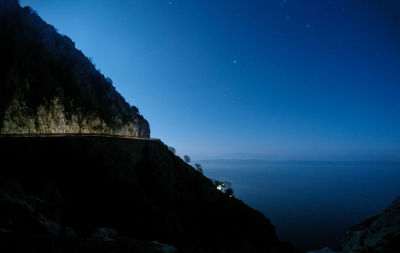 Scenic view of sea against sky at night