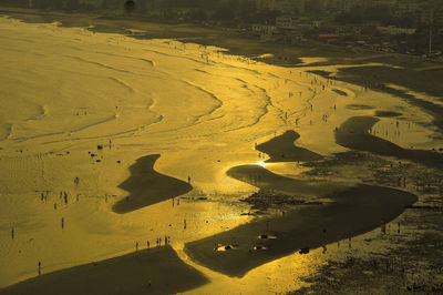 Scenic view of beach against sky during sunset