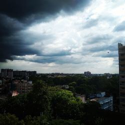 High angle view of trees and buildings against sky