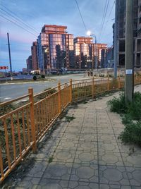 Street amidst buildings in city against sky