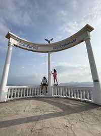 People at observation point against sky