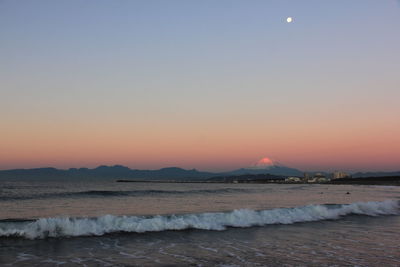 Scenic view of sea at sunset