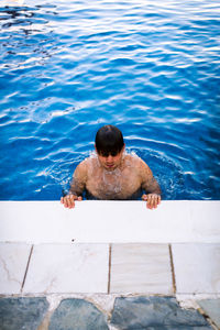 High angle view of woman swimming in pool