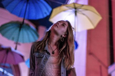 Portrait of young woman in rain