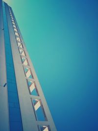 Low angle view of built structure against clear blue sky