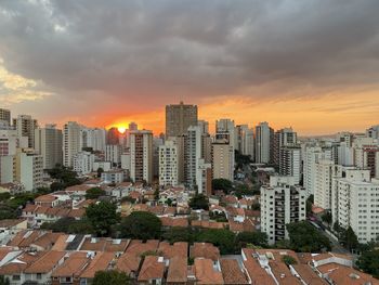 High angle view of buildings against sky during sunset