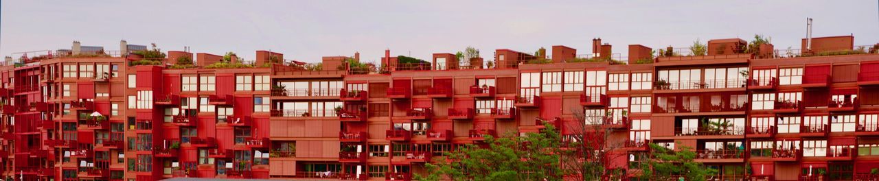 Buildings in city against clear sky