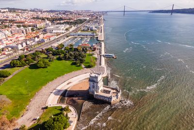 High angle view of city by sea