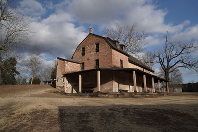 House on field against sky