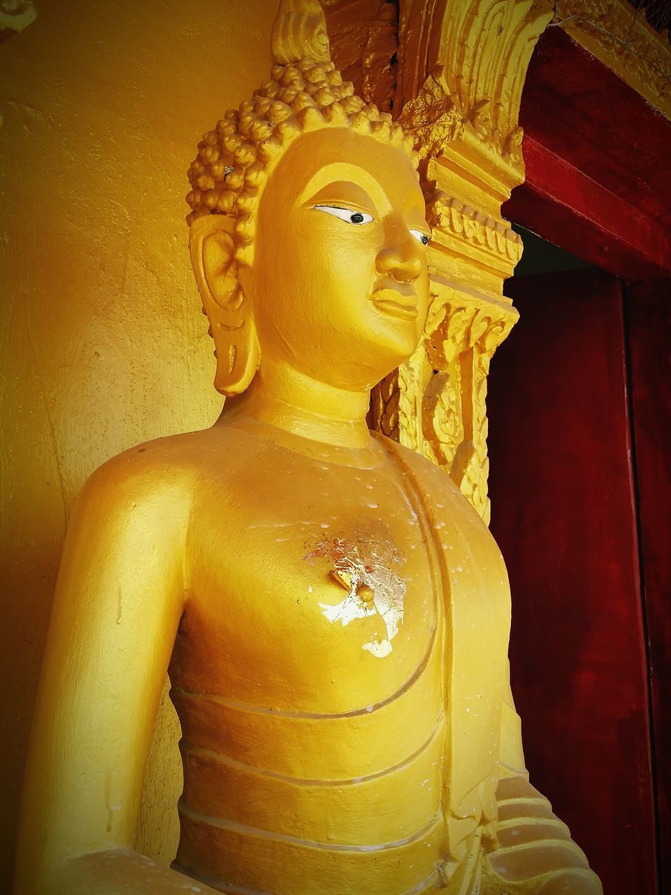 statue, human representation, sculpture, art and craft, art, creativity, religion, spirituality, buddha, indoors, place of worship, carving - craft product, low angle view, gold colored, famous place, temple - building, close-up