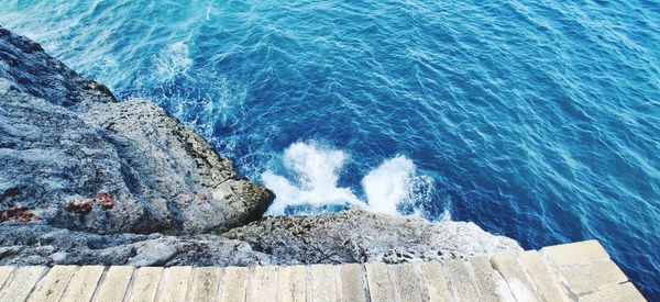 High angle view of rocks in sea