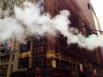 Low angle view of building against cloudy sky