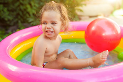 Portrait of a smiling girl in swimming pool