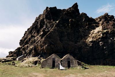 Panoramic shot of rock formations on land against sky