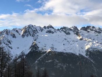 Scenic view of snowcapped mountains against sky