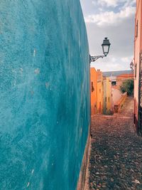 Street amidst buildings against sky