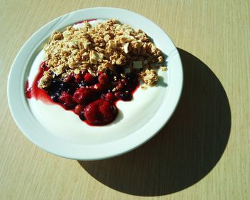 Close-up of strawberries in plate on table
