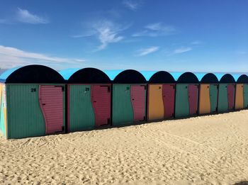 Beach huts against sky