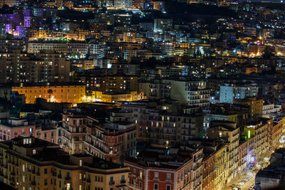 Aerial view of illuminated city at night