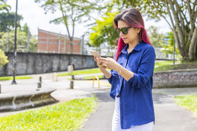 Young woman using mobile phone