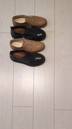 High angle view of shoes on wooden table