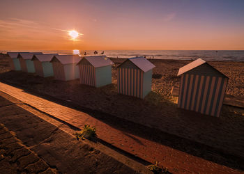 Scenic view of beach against sky during sunset