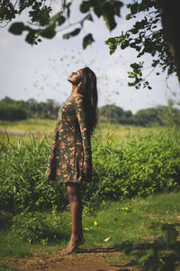 Woman standing on field