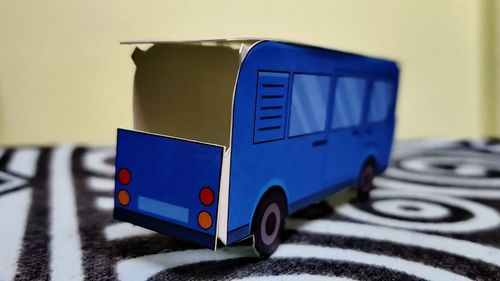 Close-up of toy car against wall
