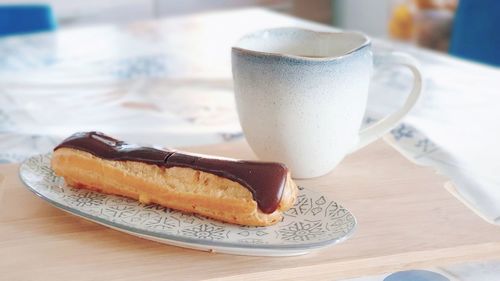 Close-up of coffee cup on table